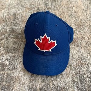 New Era Blue Baseball Cap with Red Maple Leaf Patch